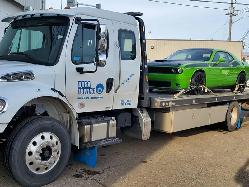 Bora Towing flatbed with green Dodge Challenger sports car in Edmonton