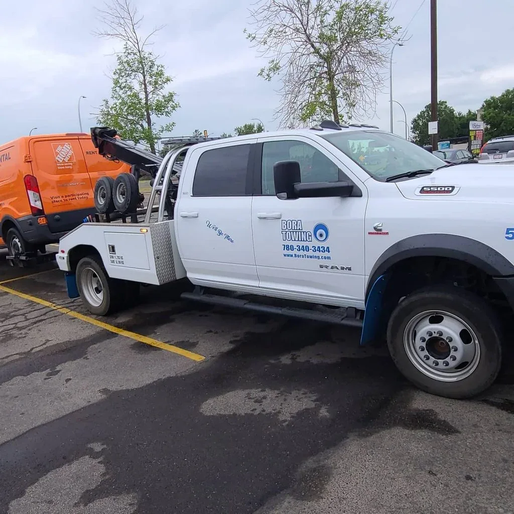 Bora Towing Ram 5500 wheel-lift towing a rental van trailer in Edmonton
